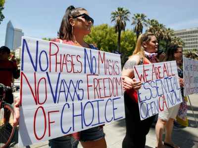 Coronavirus Conspiracy Theories and Reopen Protests as Death Denial